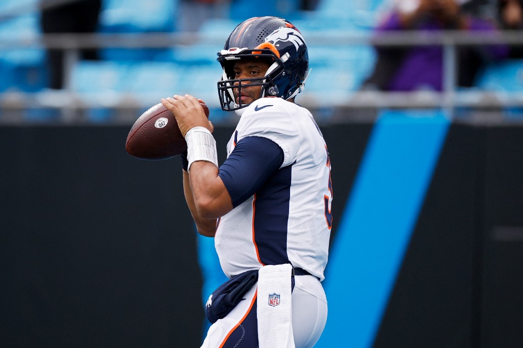 Russell Wilson of the Denver Broncos throws the ball during the first half against the Carolina Panthers, and we offer our top NFL parlay picks for Week 4 based on the best NFL odds.