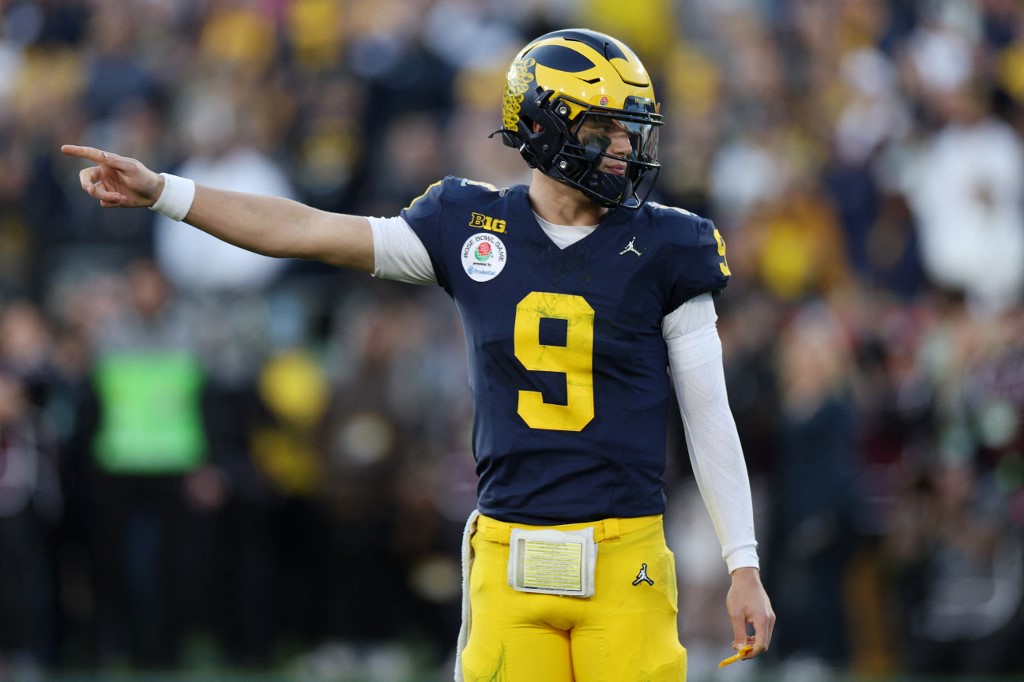 J.J. McCarthy of the Michigan Wolverines signals in the third quarter as we share our best McCarthy player props for the national championship game.