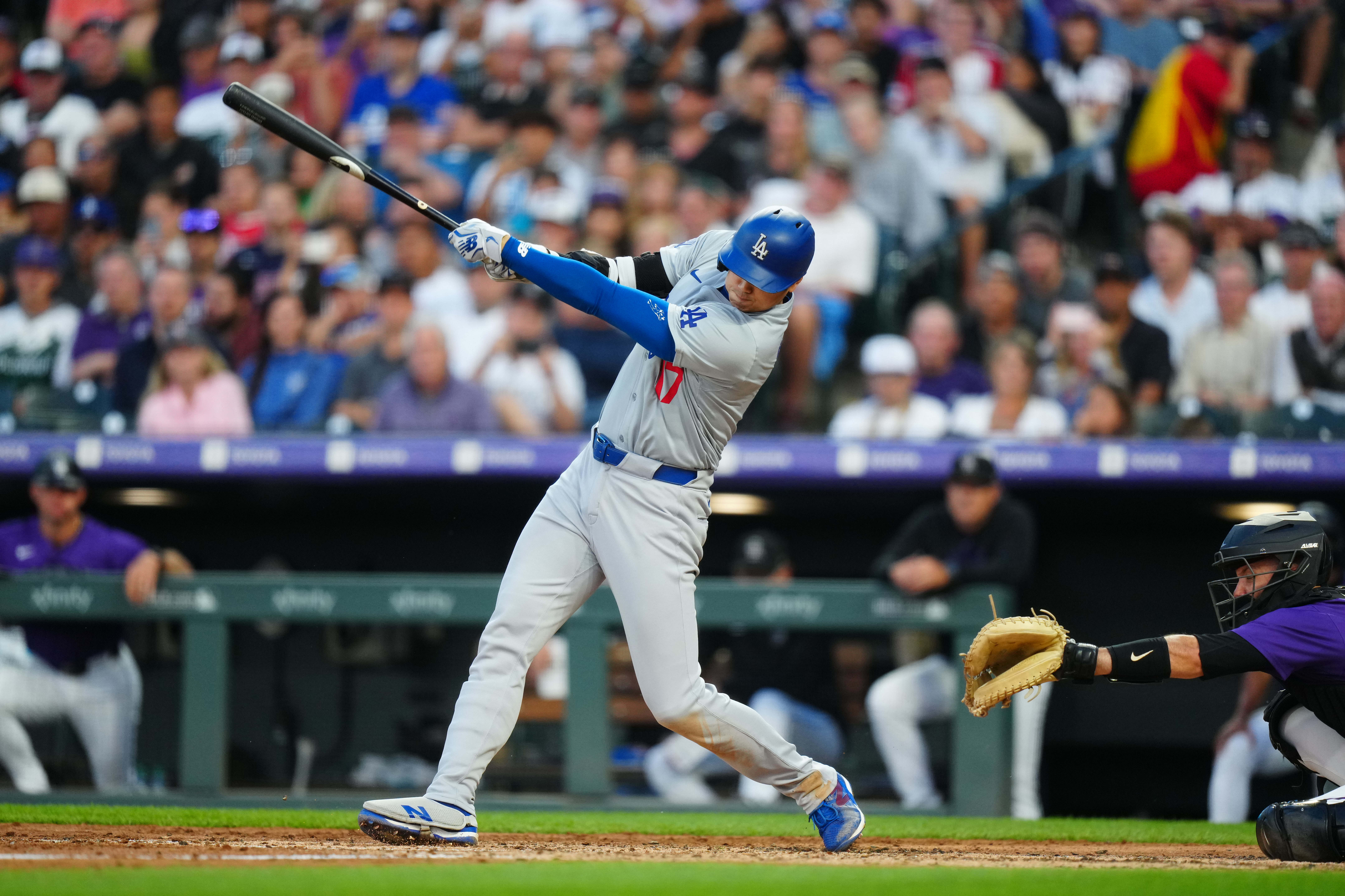 Los Angeles Dodgers designated hitter Shohei Ohtani swings the bat in the sixth inning against the Colorado Rockies at Coors Field. We're backing Ohtani in our home run props.