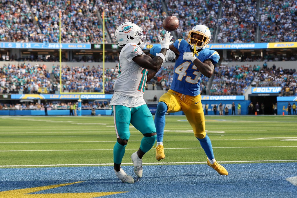 Tyreek Hill of the Miami Dolphins catches a touchdown against Michael Davis of the L.A. Chargers at SoFi Stadium on Sept. 10, 2023 in Inglewood, California as we share our favorite Dolphins vs. Patriots pick.
