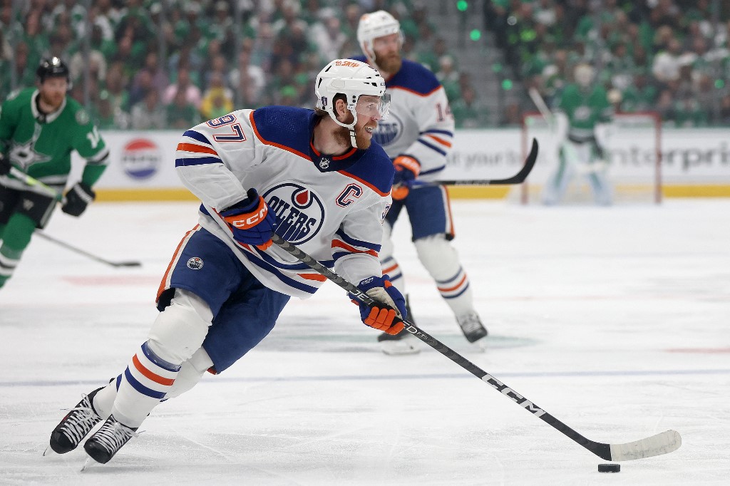 Connor McDavid of the Edmonton Oilers resets the offence against the Dallas Stars in the first period during Game 2 of the Western Conference Final. We're backing McDavid in our Stars vs. Oilers Predictions.