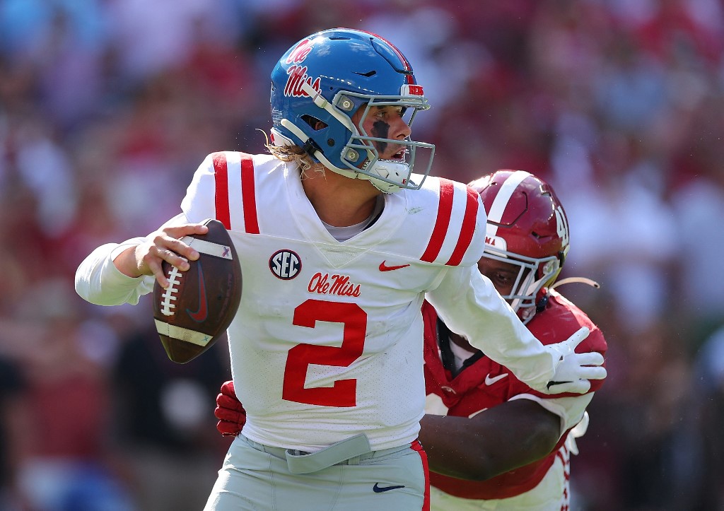 Jaxson Dart #2 of the Mississippi Rebels rushes out of the pocket as we make our Ole Miss vs. Penn State prediction and pick for the 2023 Peach Bowl on Saturday.