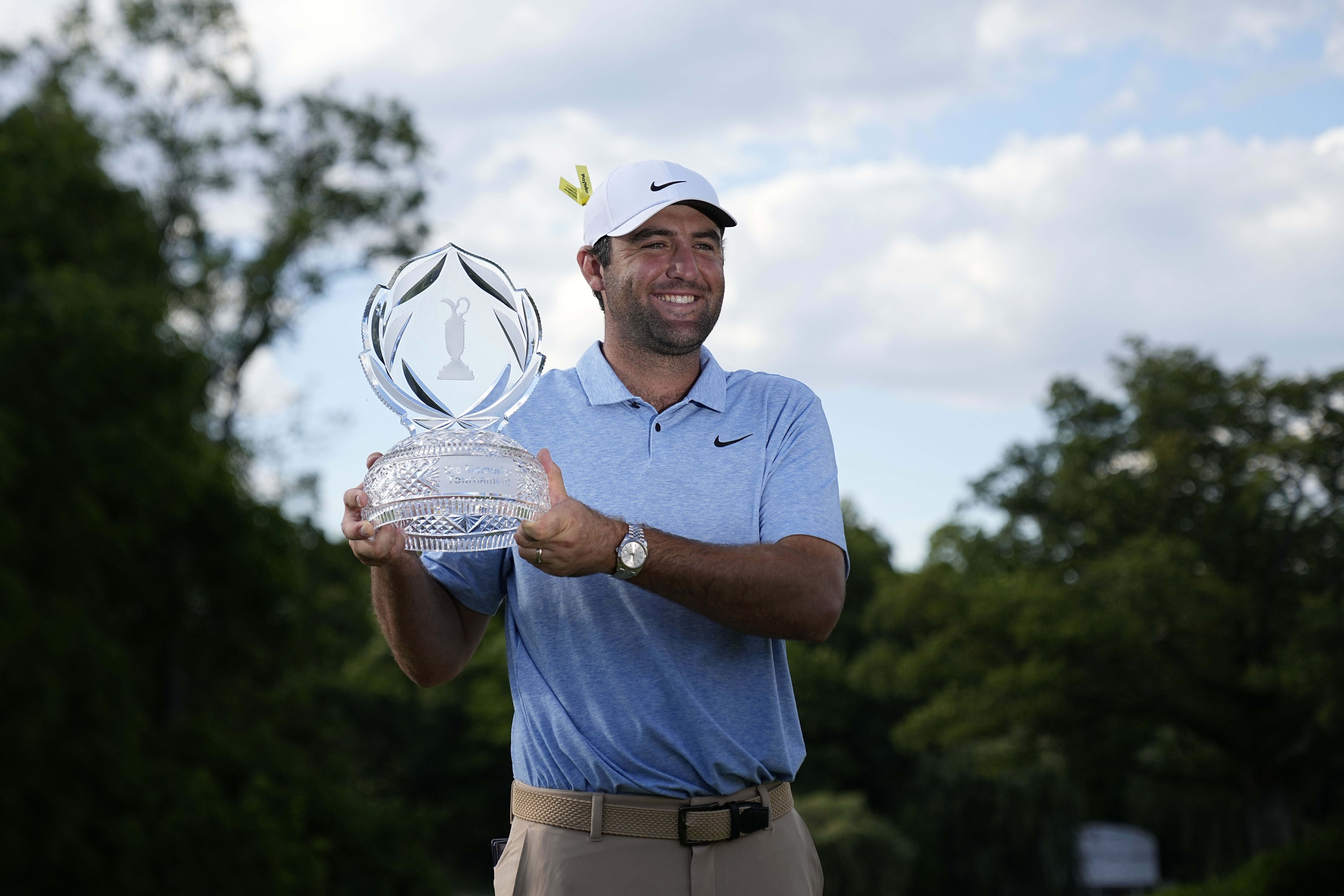 Scottie Scheffler poses for a photograph with the trophy as we make our U.S. Open expert picks.