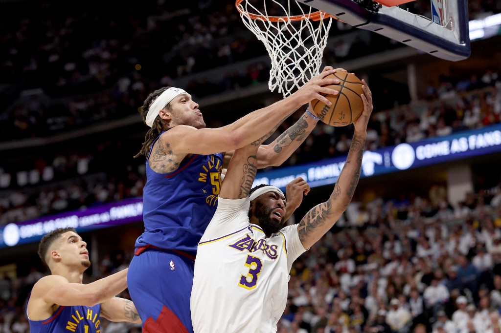 Aaron Gordon of the Denver Nuggets fights for a rebound against Anthony Davis of the Los Angeles Lakers, and we offer our top Nuggets vs. Lakers player props and expert picks based on the best NBA odds.