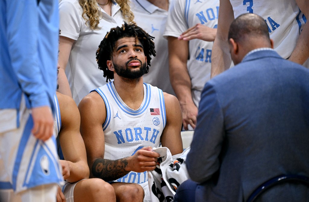 RJ Davis of the North Carolina Tar Heels listens to head coach Hubert Davis as we look at Caesars joining the North Carolina sports betting market.