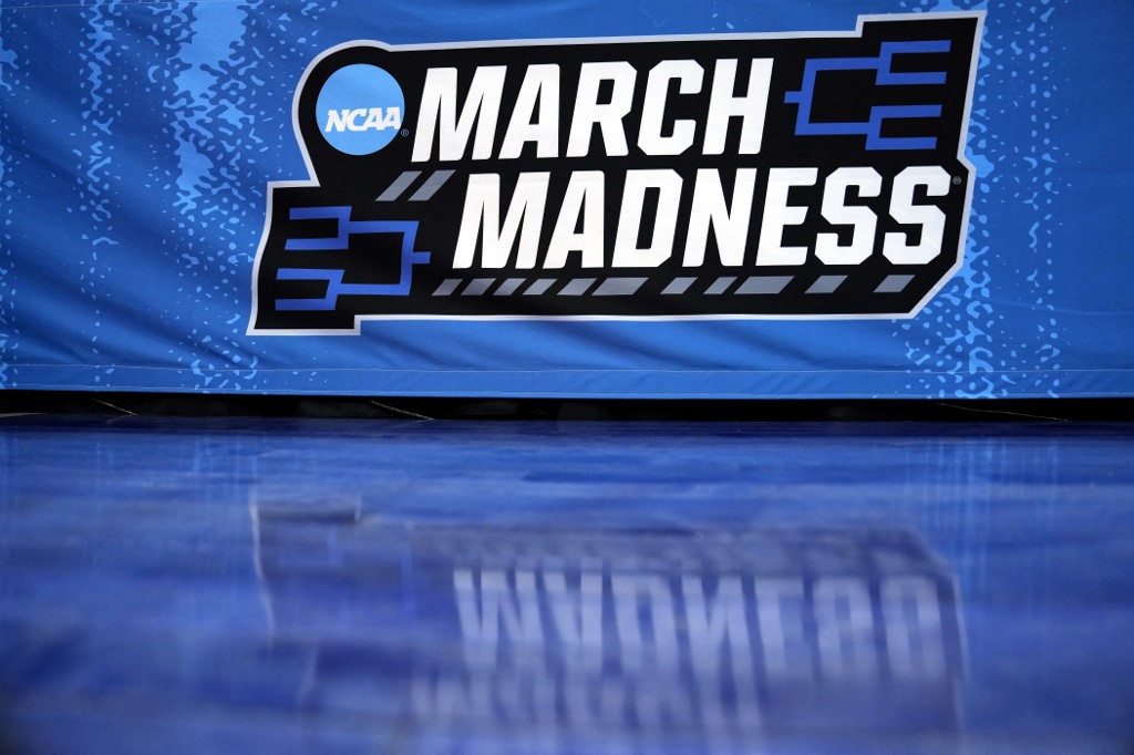 A detailed view of the March Madness logo is seen prior to the first round game between the Utah State Aggies and the Missouri Tigers in the NCAA Men's Basketball Tournament at Golden 1 Center on March 16, 2023 in Sacramento, California.