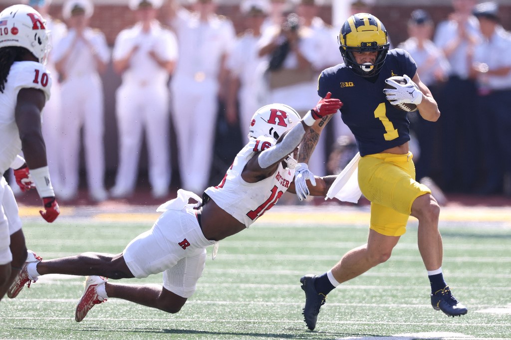 Roman Wilson #1 of the Michigan Wolverines looks for yards after a first half catch as we make our predictions for the 2024 NFL Draft Combine odds and props.