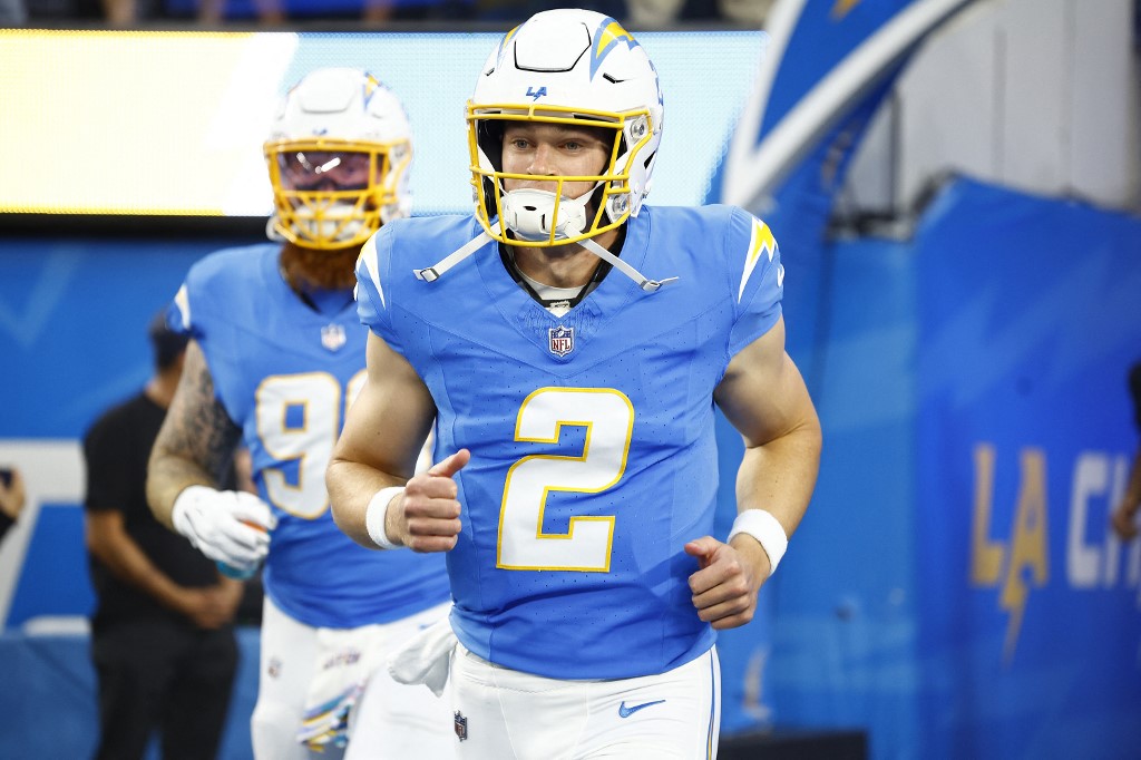Easton Stick of the Los Angeles Chargers runs onto the field at SoFi Stadium, and we offer our top Easton Stick player props for Thursday Night Football between the Chargers and Raiders based on the best NFL odds.