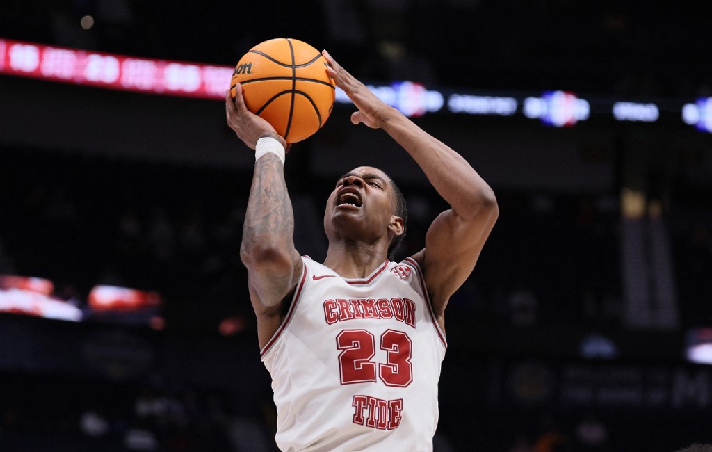 Nick Pringle #23 of the Alabama Crimson Tide shoots the ball as we look at our Caesars promo code for March Madness