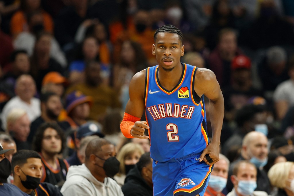 Shai Gilgeous-Alexander of the Oklahoma City Thunder reacts after a 3-point shot against the Phoenix Suns during the second half of the NBA game at Footprint Center on December 23, 2021 in Phoenix, Arizona.