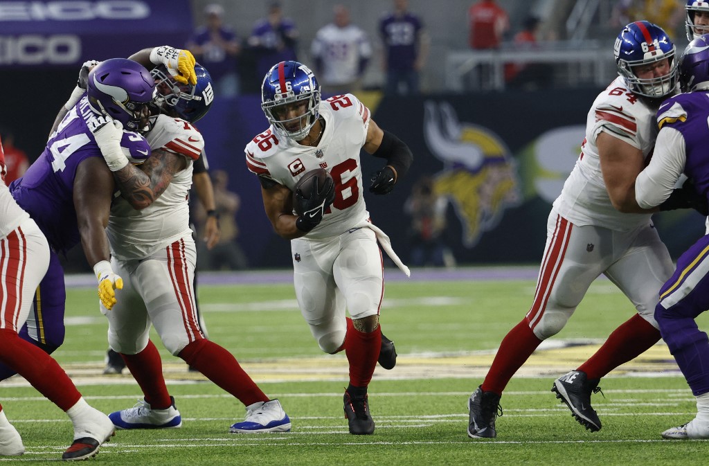 Saquon Barkley of the New York Giants rushes against the Minnesota Vikings at U.S. Bank Stadium on Jan. 15, 2023 in Minneapolis, Minnesota as we share our favorite Giants vs. Cardinals prediction.