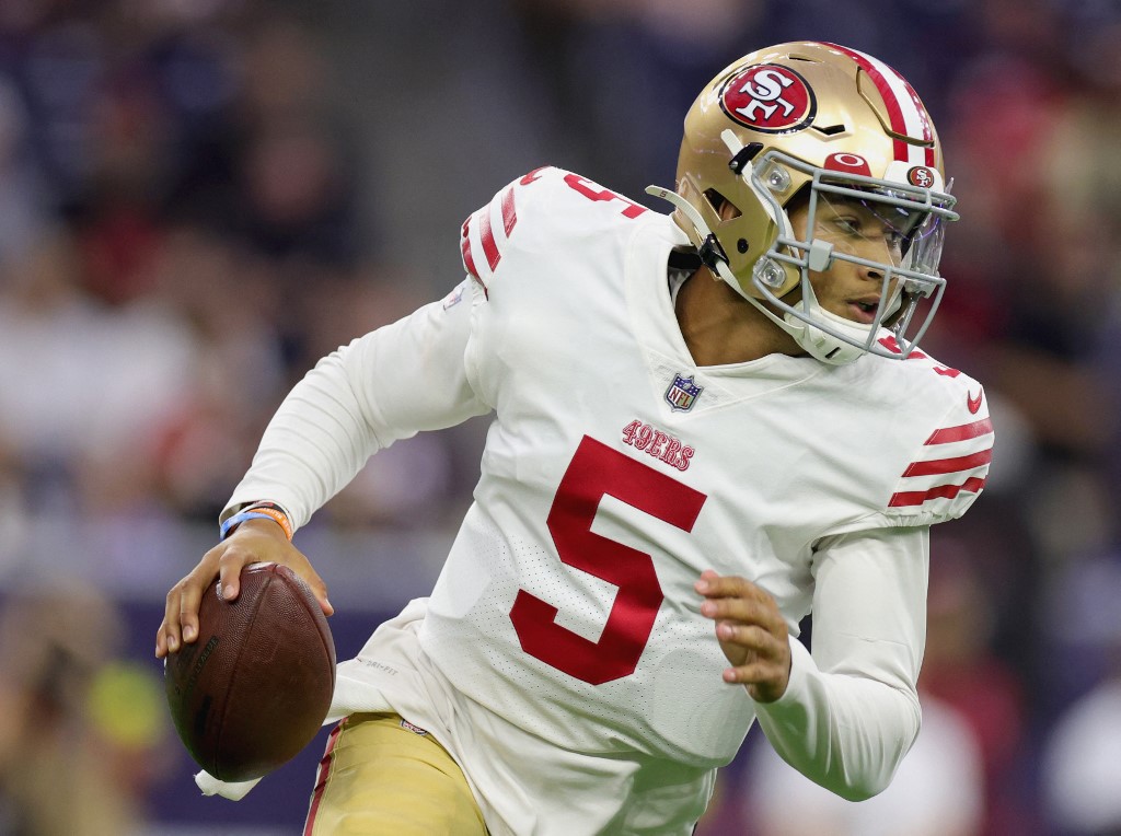 San Francisco 49ers quarterback Trey Lance looks to pass during the first quarter of a preseason game against the Houston Texans at NRG Stadium on August 25, 2022 in Houston, Texas.