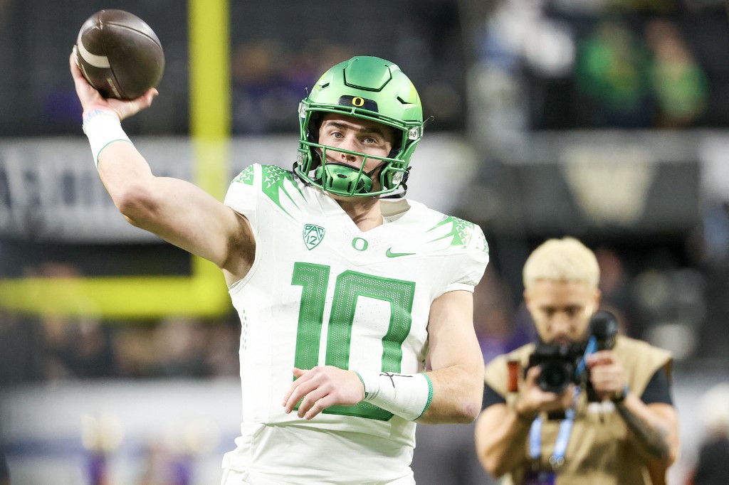 Bo Nix of the Oregon Ducks warms up prior to a game against the Washington Huskies during the Pac-12 Championship as we look at our Oregon-Liberty prediction.