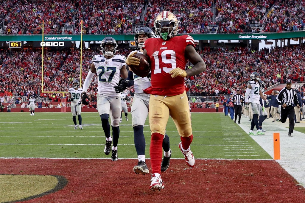 Deebo Samuel of the San Francisco 49ers scores a 74-yard touchdown against the Seattle Seahawks in the NFC Wild Card playoff game at Levi's Stadium on Jan. 14, 2023 in Santa Clara, California.