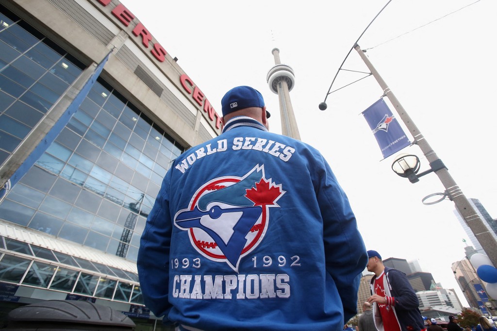A fan waits outside the Rogers Centre as we look at the launch of Soft2Bet in Ontario