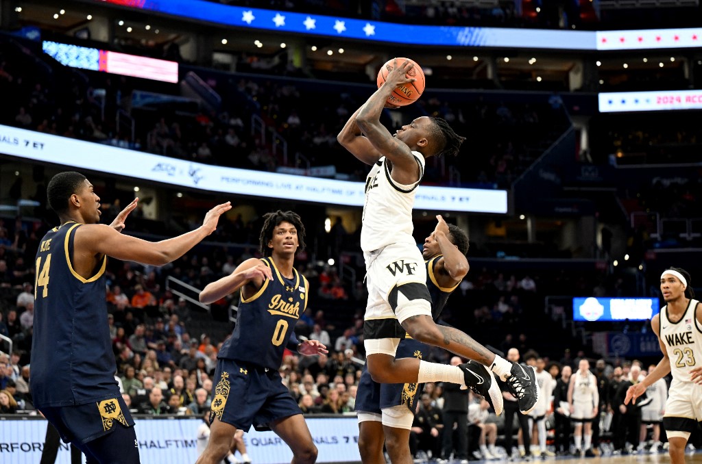 Kevin Miller #0 of the Wake Forest Demon Deacons drives to the basket as we look at our Caesars North Carolina promo code