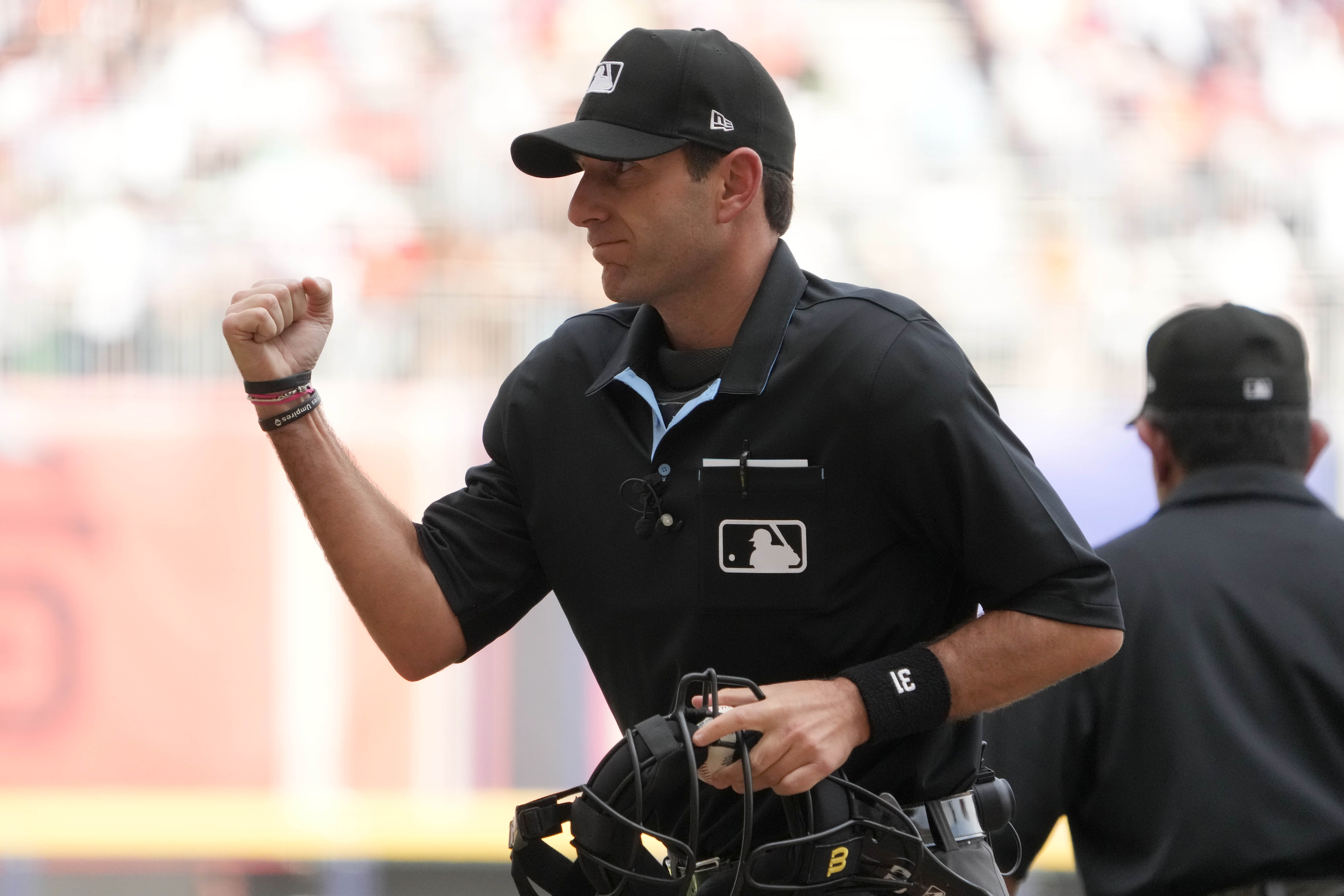 Home plate umpire Pat Hoberg calls an out in the fifth inning during an MLB World Tour game between the San Diego Padres and the San Francisco Giants as we look at the Pat Hoberg MLB gambling scandal.