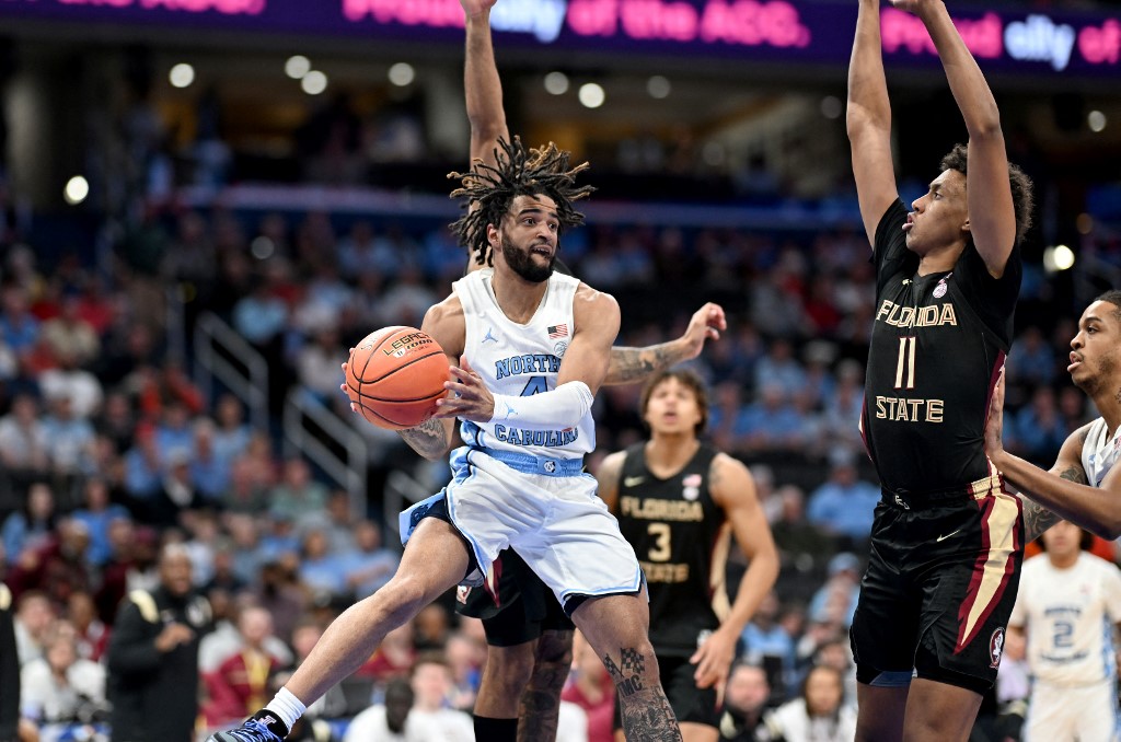 RJ Davis #4 of the North Carolina Tar Heels passes the ball as we look at our Caesars North Carolina promo code